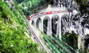 A train entering a mountain tunnel